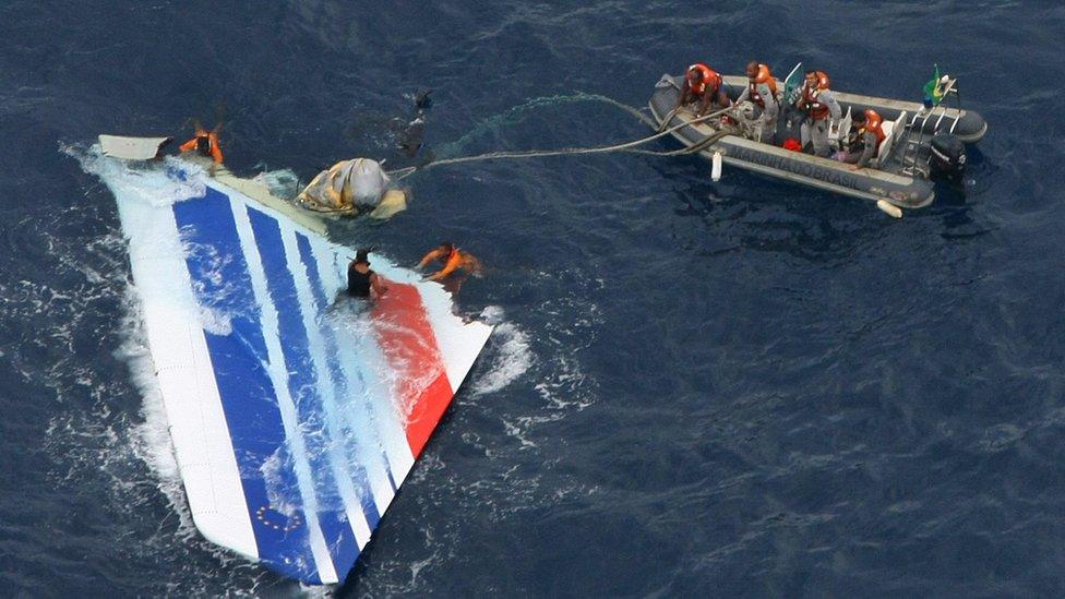 Brazilian navy divers recovering part of the tail section from Air France flight 447