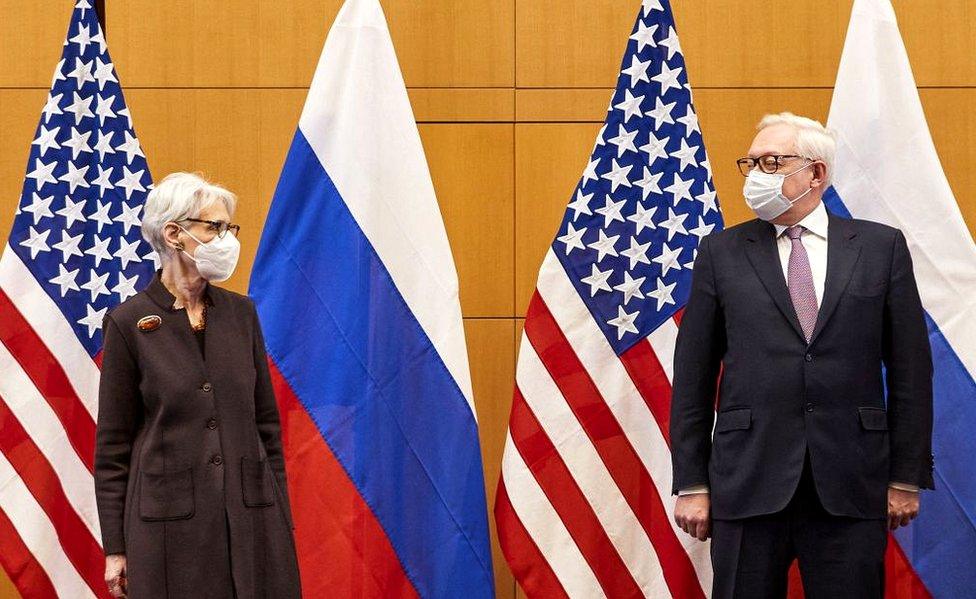 US Deputy Secretary of State Wendy Sherman (L) and Russian deputy Foreign Minister Sergei Ryabkov (R) pose for pictures as they attend security talks on soaring tensions over Ukraine, at the US permanent Mission, in Geneva, on January 10, 2022