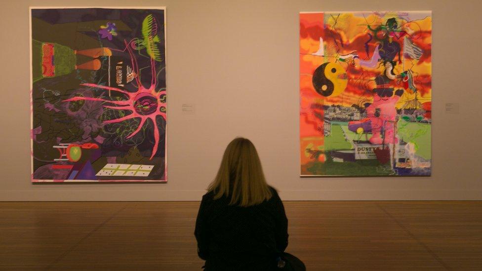 A woman views contemporary pop art is on display at the Montreal Museum of Fine Arts