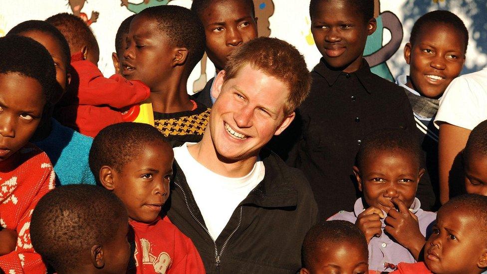 Prince Harry meets youngsters in the grounds of the Mants'ase children's home, while on a return visit to Lesotho in southern Africa