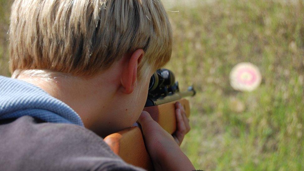 Boy with air gun