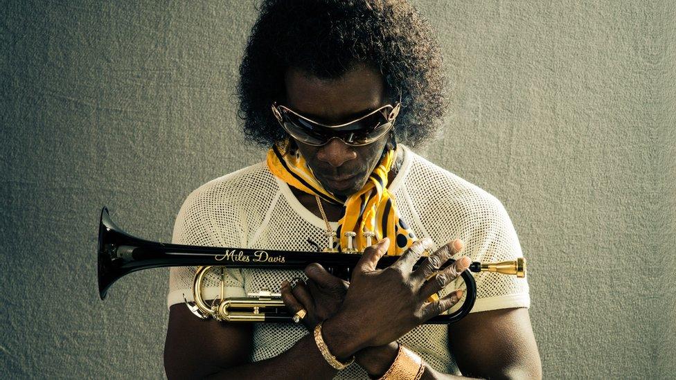 Don Cheadle as Miles Davis