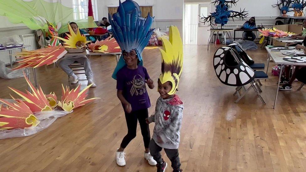 Children try out headdresses