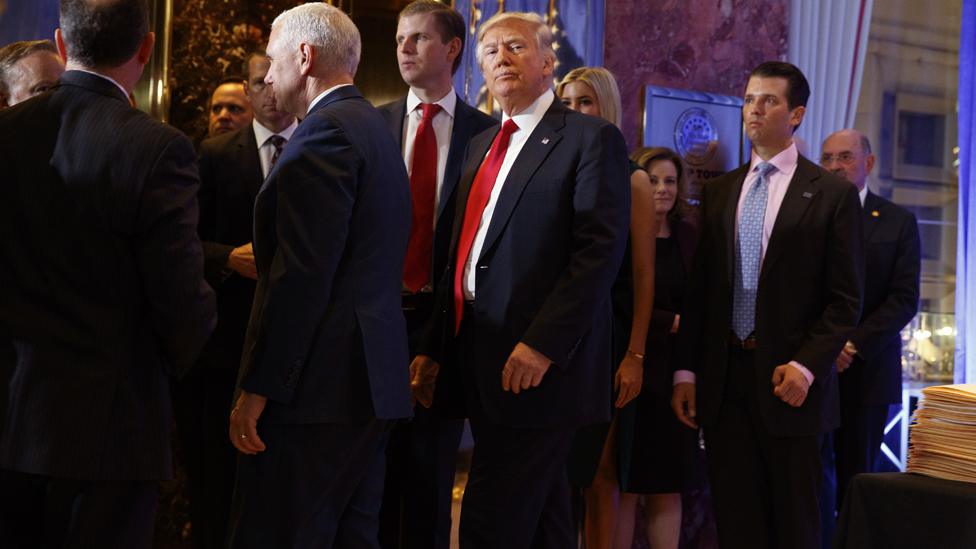 President-elect Donald Trump speaks leaves a news conference in the lobby of Trump Tower in New York, Wednesday, Jan. 11, 2017