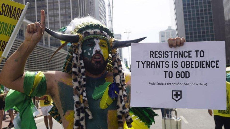 Supporters of President of Brazil Jair Bolsonaro gather as they wave flags during a demonstration during Brazil's Independence Day at Paulista Avenue on September 07, 2021 in Sao Paulo, Brazil.