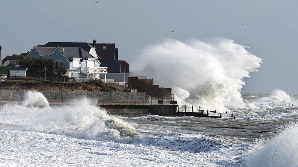 Selsey beach house in West Sussex with waves crashing from the sea