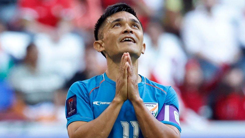 India's forward #11 Sunil Chhetri reacts during the Qatar 2023 AFC Asian Cup Group B football match between Syria and India at Al-Bayt Stadium in al-Khor, north of Doha, on January 23, 2024. (Photo by KARIM JAAFAR / AFP) (Photo by KARIM JAAFAR/AFP via Getty Images)