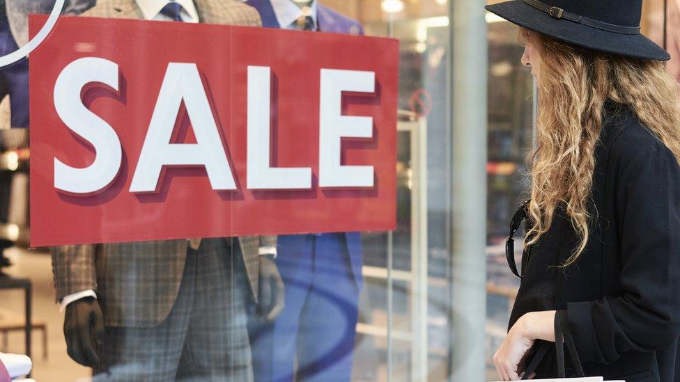 Shopper looking at shop window