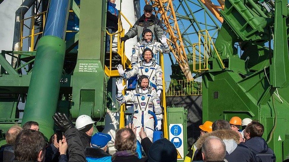 Astronauts boarding the Soyuz.