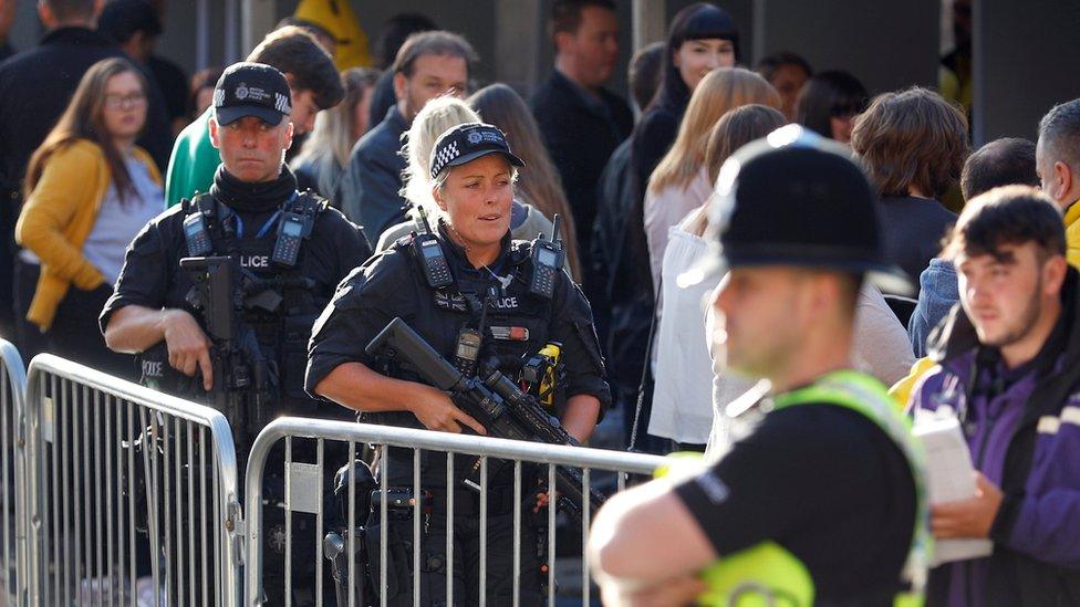 Armed police outside the arena