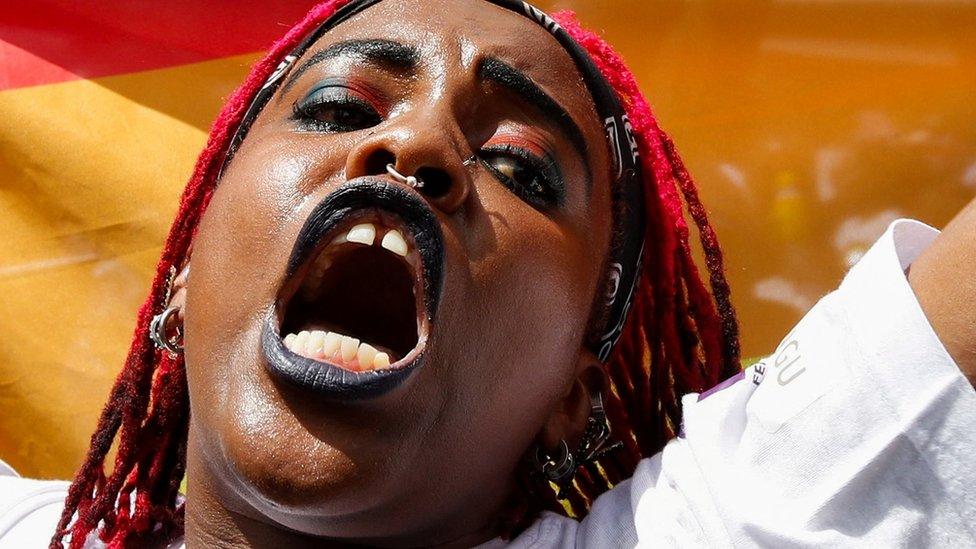 A protestor shouting at the rally.