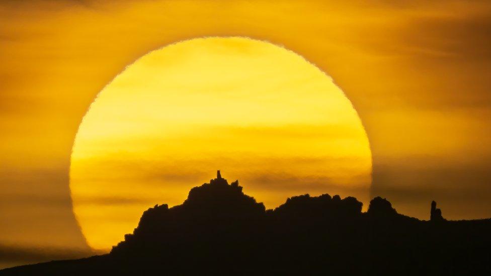 Sun setting behind Manstone Rock on the Stiperstones ridge, in Shropshire