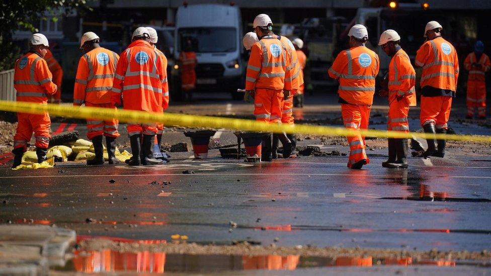 Thames Water officials work in Tollington Road near to the junction with Hornsey Road, Holloway, north London, after a 36-inch water main burst, causing flooding up to four feet deep