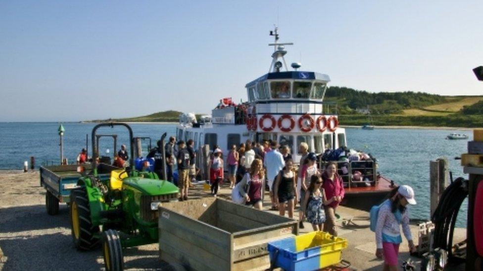 Tourist arrive on the Herm Trident