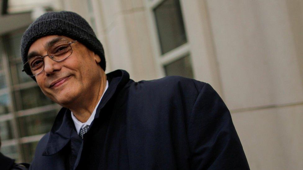 Former president of Peruvian Football Federation Manuel Burga, one of three defendants in the FIFA corruption trial, smiles as he exits the United States Federal Court in Brooklyn, New York, U.S., December 26, 2017.