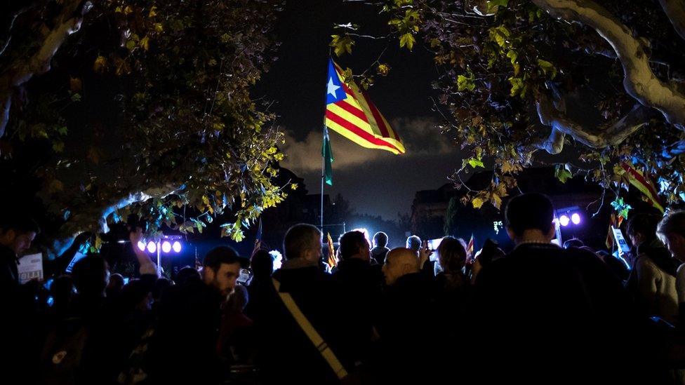 People attend a gathering in support of the members of the dismissed Catalan cabinet