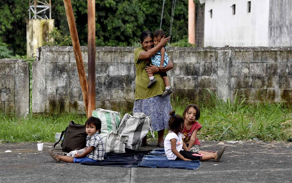 Displaced people in an area affected by the eruption of Fuego volcano