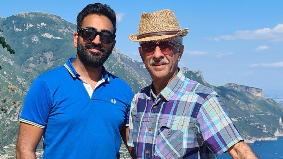 Sanjay Dattani and his dad Sunil in front of a mountain