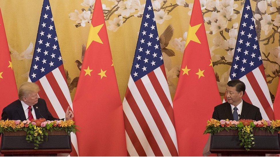 US President Donald Trump and Chinese President Xi Jinping speak during a joint statement in Beijing on November 9, 2017.