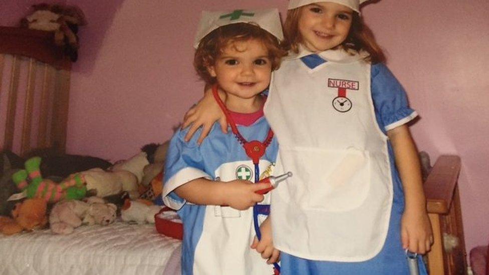 Two sisters dressed up as nurses