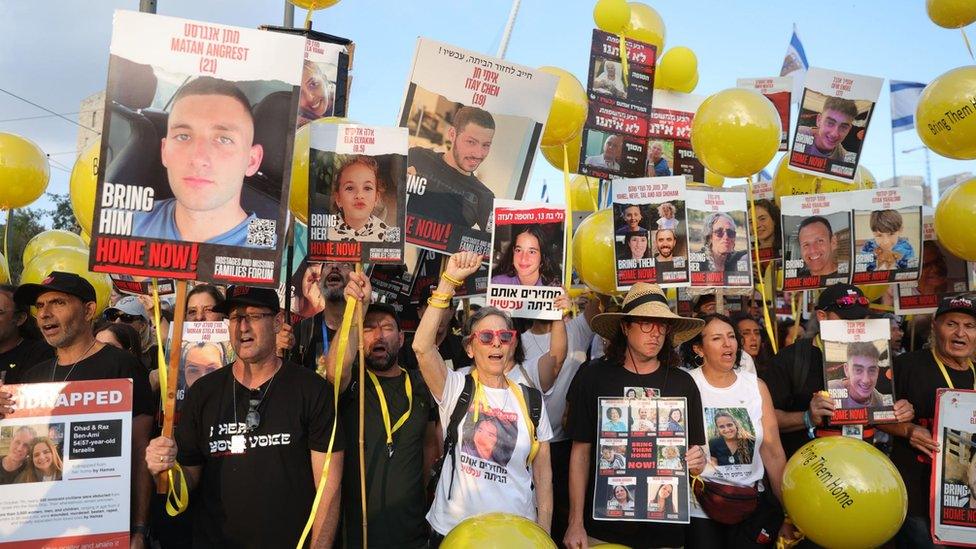 Family members, friends and supporters of the hostages held by Hamas in Gaza take part in a march from Tel Aviv to Jerusalem