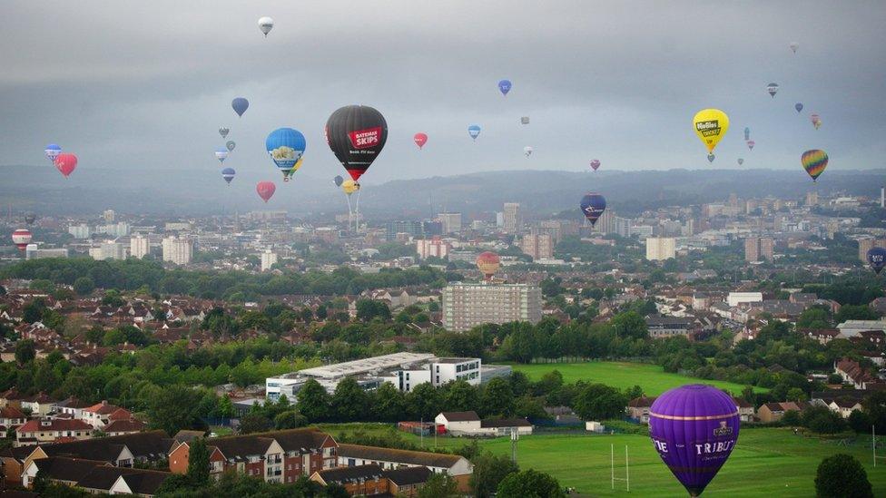 Dozens of balloons over Bristol, foreground and in distance