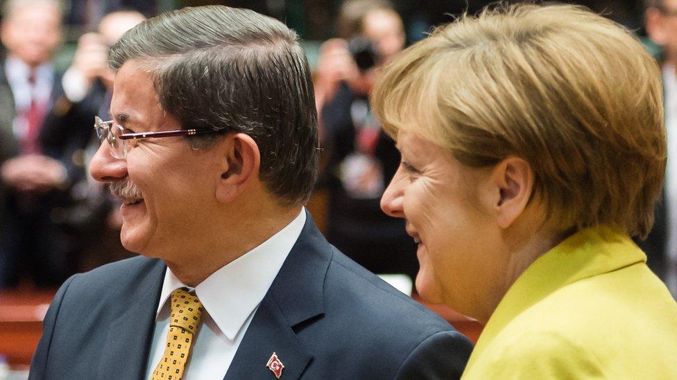 The German chancellor with Turkish PM Ahmet Davutoglu (L) on 18 March in Brussels