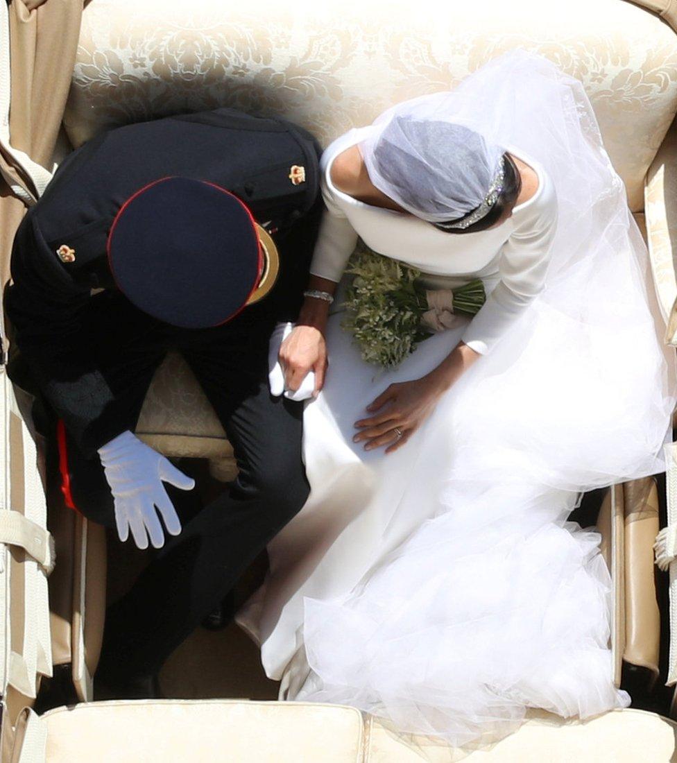 Prince Harry and Meghan Markle ride in an Ascot Landau along the Long Walk after their wedding in St George's Chapel