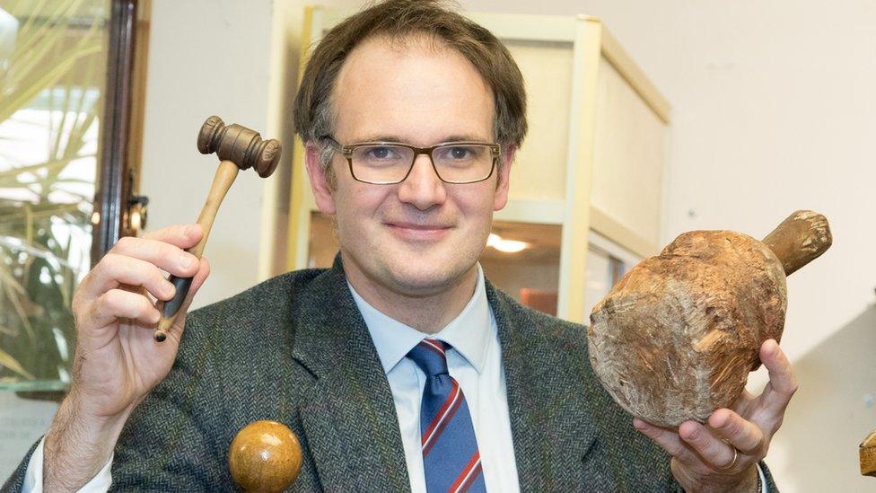 Auctioneer with 4,500-year wooden maul