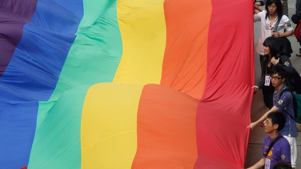 LGBT rights supporters hold a giant rainbow flag at Hong Kong gay pride parade