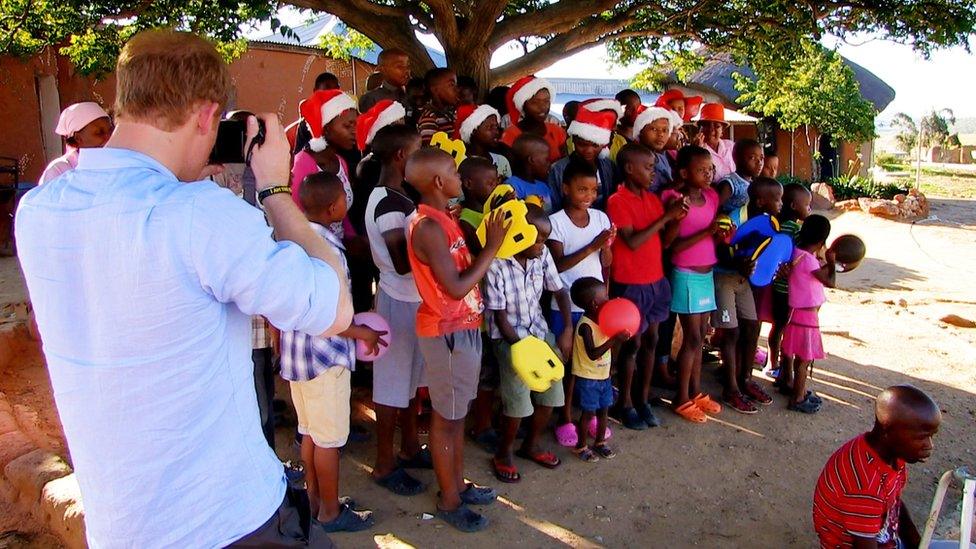 Prince Harry with children in Lesotho