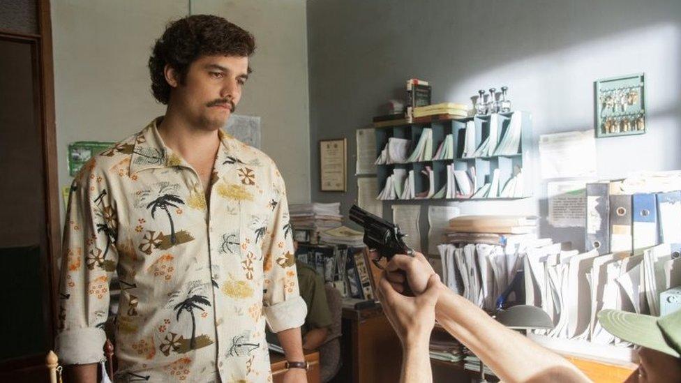 This image released by Netflix shows Wagner Moura as Pablo Escobar in the Netflix Original Series "Narcos." In a partnership with Univision, the Netflix series will air on the network.