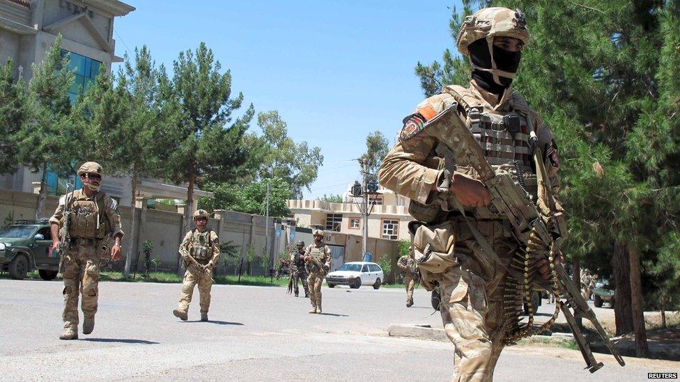 Afghan security forces arrive at the site of an attack in Helmand province on 13 May, 2015