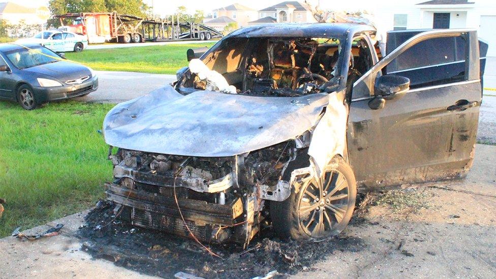 The burnt out car