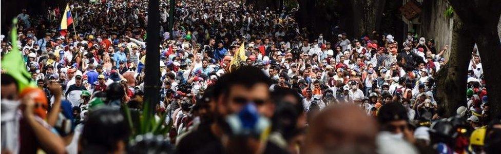 Venezuelan opposition activists march against President Nicolas Maduro, in Caracas on May 1, 2017.