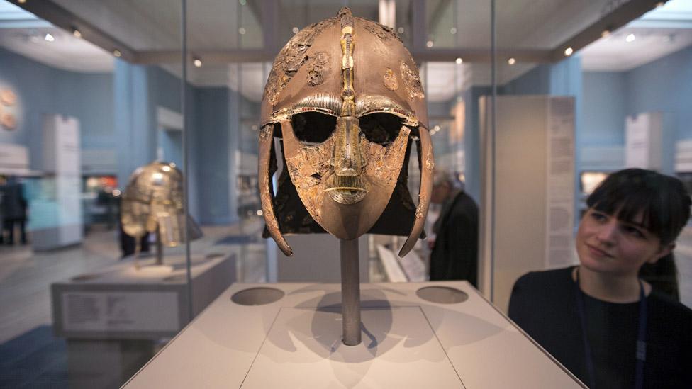 A woman views the Sutton Hoo Helmet on display in the new gallery 'Sutton Hoo and Europe AD 300-1100' in the British Museum