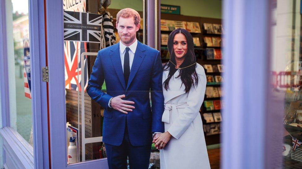 A cardboard cutout of Meghan Markle and Prince Harry