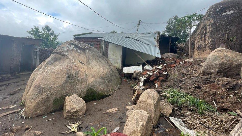 A boulder outside a house