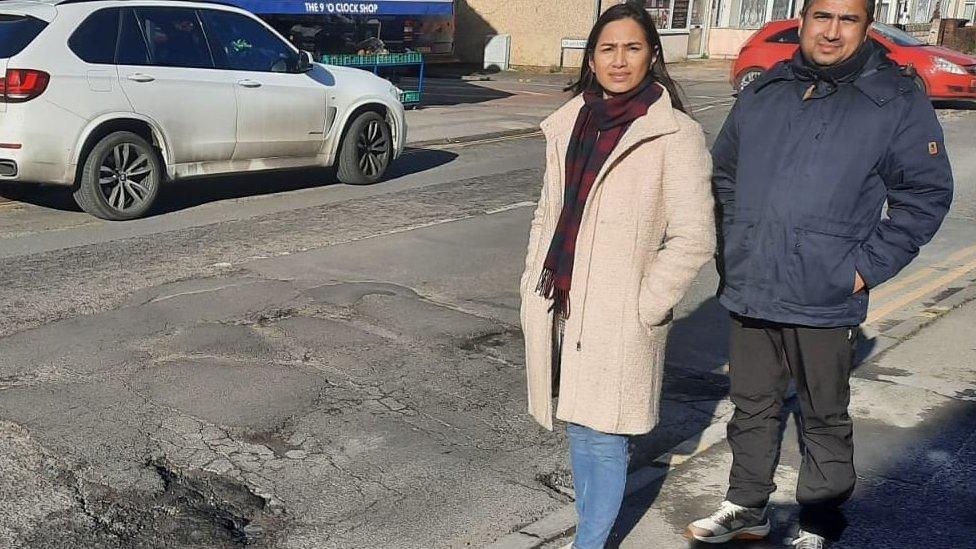 Adoreabelle Shaikh and William Fernandes near a very rough section of Manchester Road