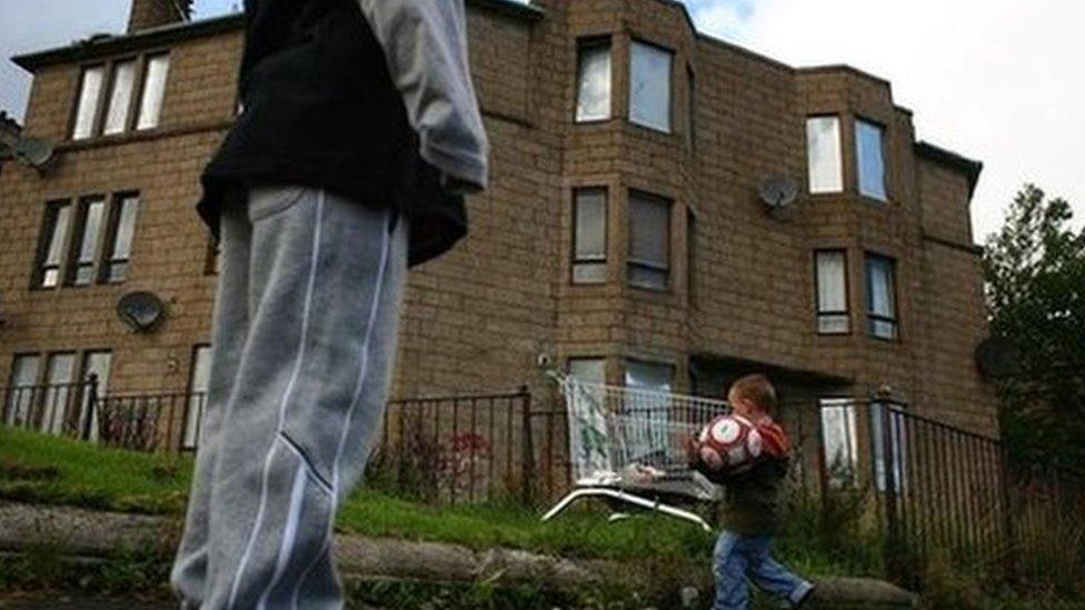 A child playing football in the Govan area of Glasgow