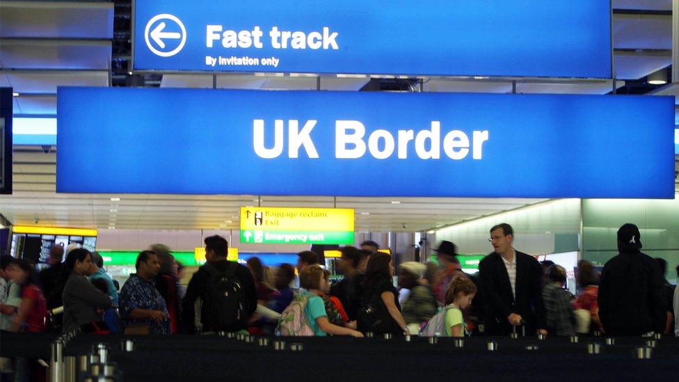 Passengers going through the UK Border at Terminal 2 of Heathrow Airport