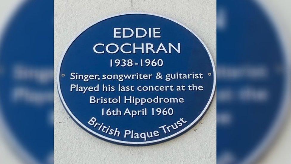 A blue plaque saying 'Eddie Cochran, 1938 - 1960, Singer, songwriter and guitarist. Played his last concert at the Bristol Hippodrome, 16 April 1960