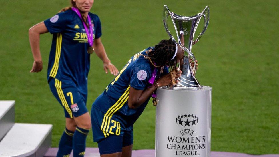 Melvine Malard of Lyon football team kisses trophy