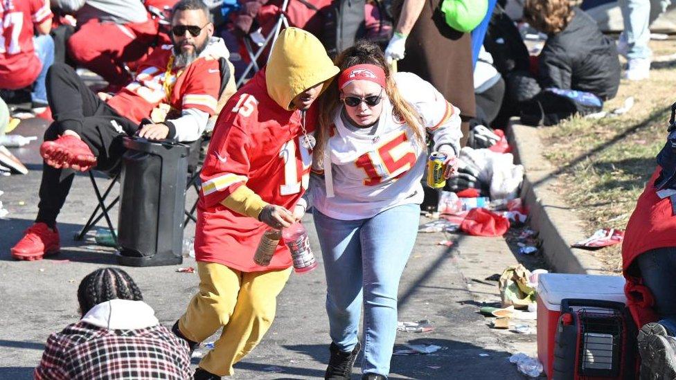 Fans leave the area after shots were fired after the celebration of the Kansas City Chiefs winning Super Bowl LVIII.