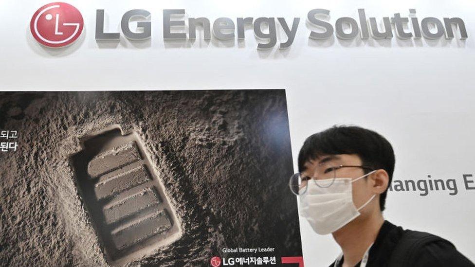 A visitor walks past a booth of LG Energy Solution at an exhibition in Seoul.