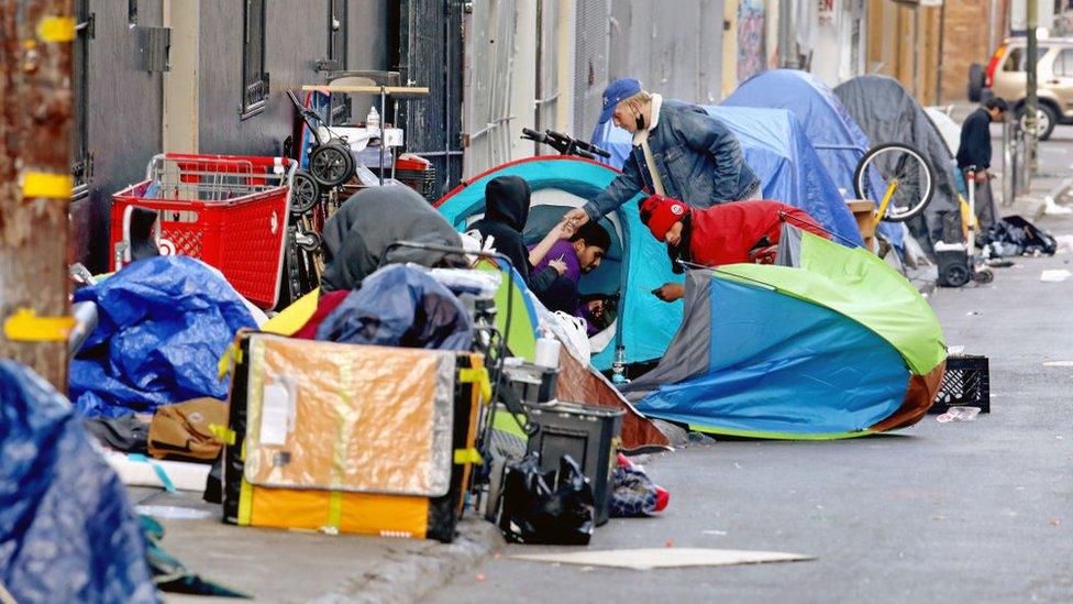 Homeless people seen consuming drugs in San Francisco's Tenderloin district in 2021