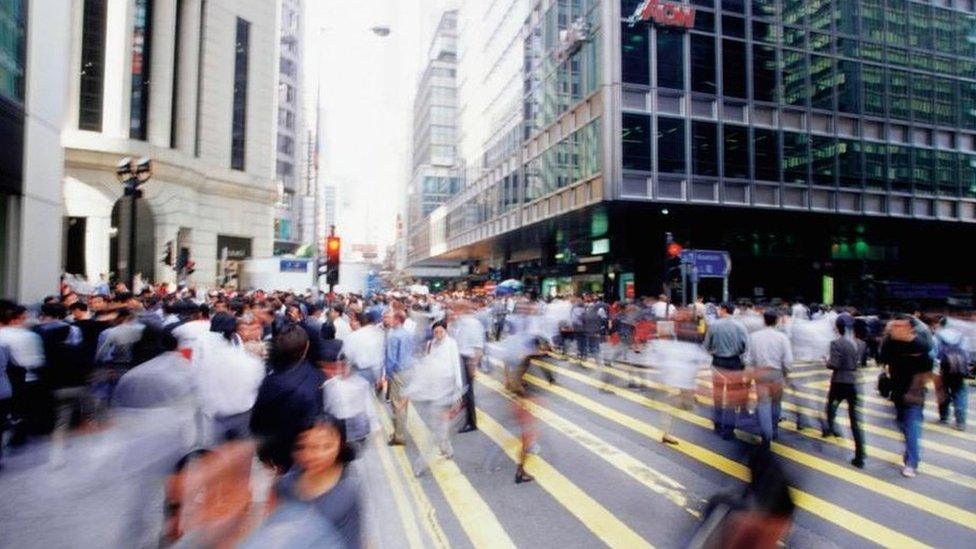 Cityscape with blurred crowd