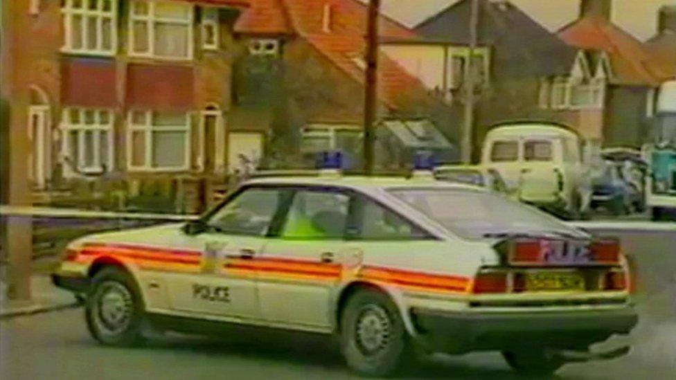 A police car at the scene of Gérard Hoarau's murder in Edgware in London