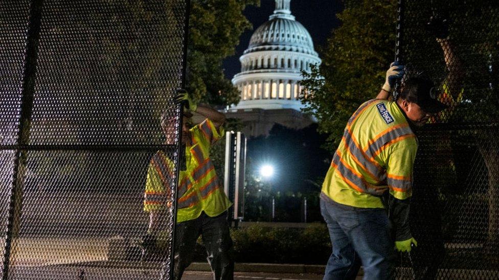 Workers have installed temporary fencing outside the US Capitol