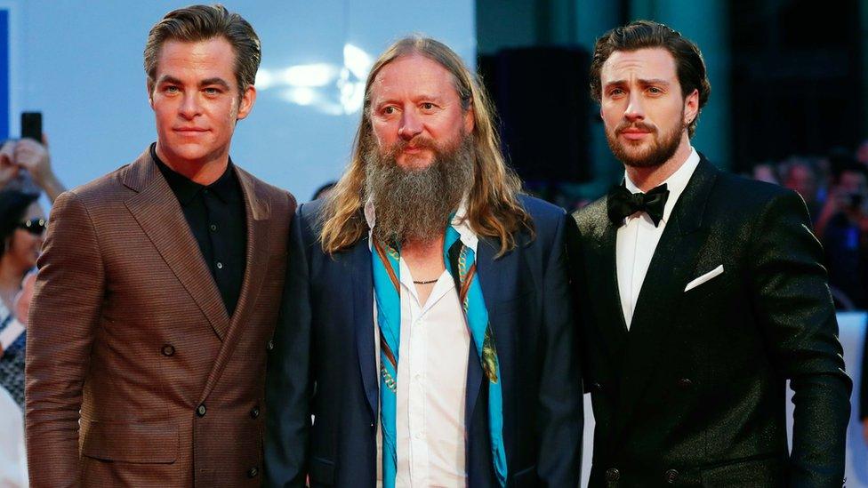 Actors Chris Pine (L) and Aaron Taylor-Johnson (R) pose with director David Mackenzie at the world premier of Outlaw King at the Toronto International Film Festival